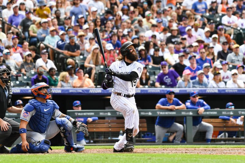 May 28, 2023; Denver, Colorado, USA; Colorado Rockies designated hitter Charlie Blackmon (19) hits a 374 ft home run in the fifth inning against the New York Mets at Coors Field. Mandatory Credit: John Leyba-USA TODAY Sports