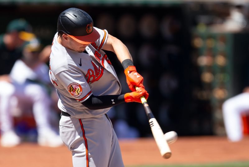 Aug 20, 2023; Oakland, California, USA; Baltimore Orioles first baseman Ryan Mountcastle (6) connects for a three run home run against the Oakland Athletics during the fourth inning at Oakland-Alameda County Coliseum. Mandatory Credit: D. Ross Cameron-USA TODAY Sports