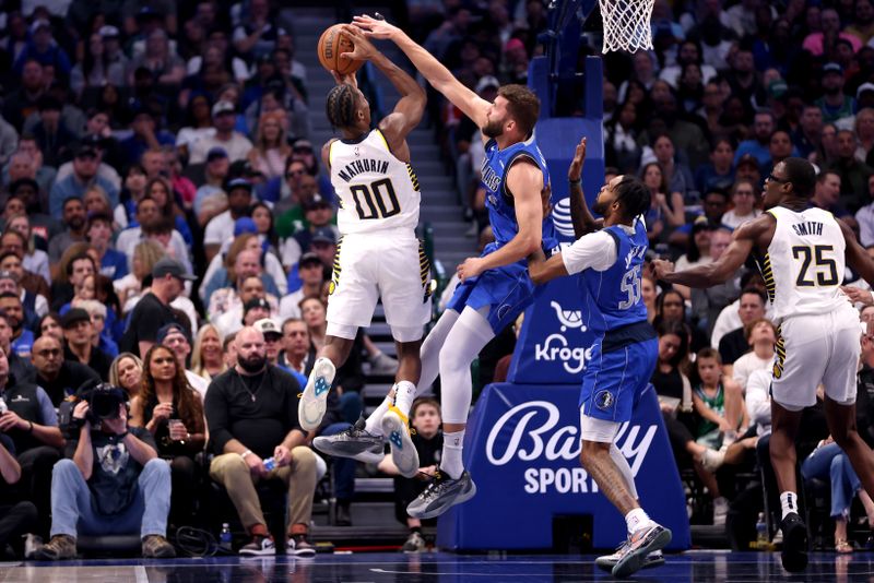 DALLAS, TEXAS - MARCH 05: Maxi Kleber #42 of the Dallas Mavericks blocks the shot of Bennedict Mathurin #00 of the Indiana Pacers in the first half at American Airlines Center on March 05, 2024 in Dallas, Texas. NOTE TO USER: User expressly acknowledges and agrees that, by downloading and or using this photograph, User is consenting to the terms and conditions of the Getty Images License Agreement. (Photo by Tim Heitman/Getty Images)