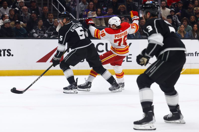 Dec 23, 2023; Los Angeles, California, USA; Calgary Flames center Martin Pospisil (76) hits Los Angeles Kings defenseman Andreas Englund (5) with his stick for a penalty during the third period of a game at Crypto.com Arena. Mandatory Credit: Jessica Alcheh-USA TODAY Sports