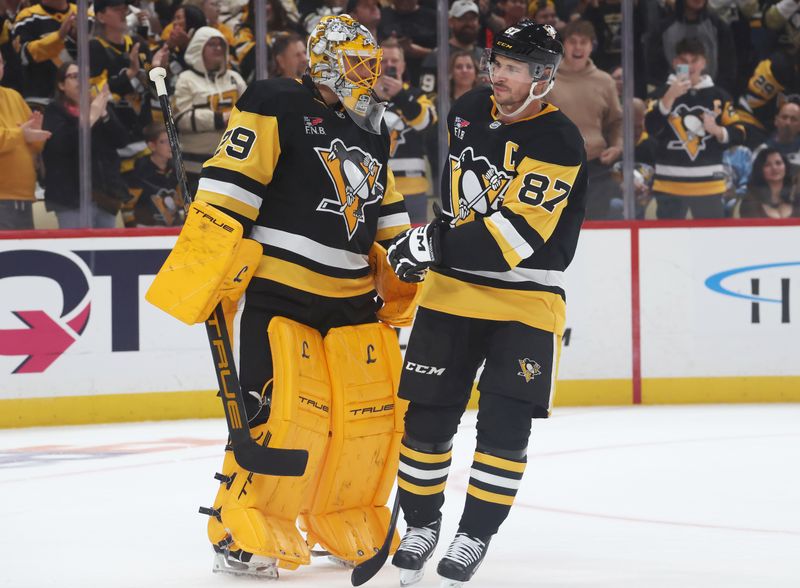Sep 27, 2025; Pittsburgh, Pennsylvania, USA;  Pittsburgh Penguins goaltender Marc-Andre Fleury (29) talks with Pittsburgh Penguins center Sidney Crosby (87) against the Columbus Blue Jackets during the third period at PPG Paints Arena. Mandatory Credit: Charles LeClaire-Imagn Images