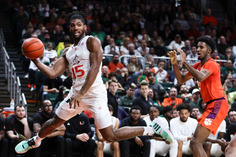 Jan 3, 2024; Coral Gables, Florida, USA; Miami Hurricanes forward Norchad Omier (15) passes the basketball against the Clemson Tigers during the second half at Watsco Center. Mandatory Credit: Sam Navarro-USA TODAY Sports