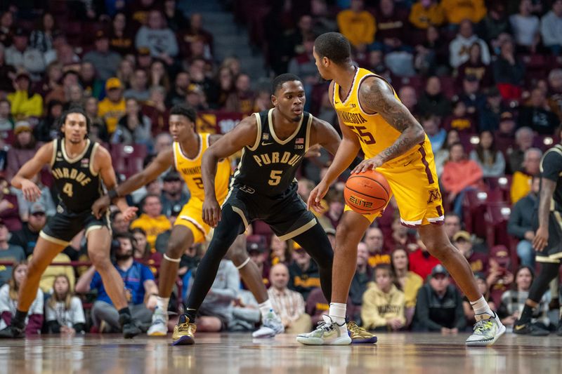 Jan 19, 2023; Minneapolis, Minnesota, USA; Minnesota Golden Gophers guard Ta'lon Cooper (55) is guarded by Purdue Boilermakers guard Brandon Newman (5) in the second half at Williams Arena. Mandatory Credit: Matt Blewett-USA TODAY Sports