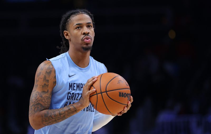 ATLANTA, GEORGIA - DECEMBER 23:  Ja Morant #12 of the Memphis Grizzlies warms up prior to facing the Atlanta Hawks at State Farm Arena on December 23, 2023 in Atlanta, Georgia.  NOTE TO USER: User expressly acknowledges and agrees that, by downloading and/or using this photograph, user is consenting to the terms and conditions of the Getty Images License Agreement.  (Photo by Kevin C. Cox/Getty Images)