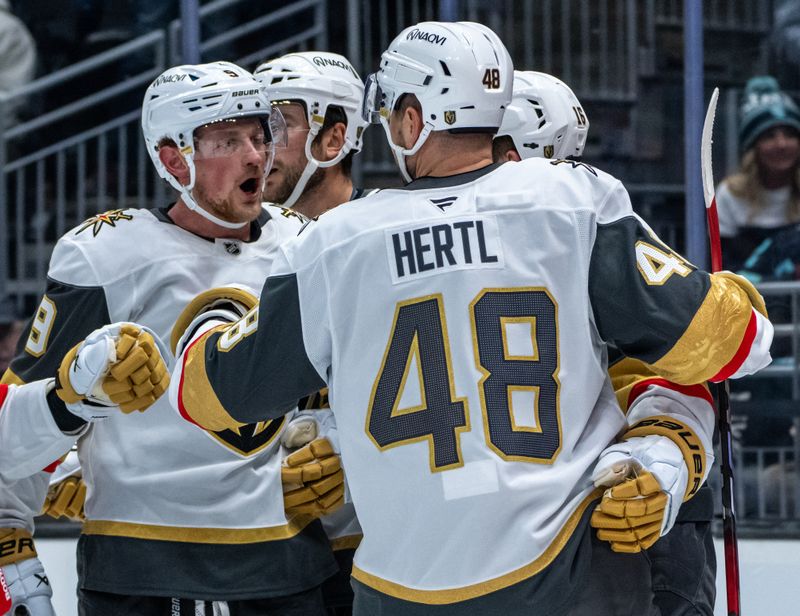 Nov 8, 2024; Seattle, Washington, USA;  Vegas Golden Knights inlcuding forward Jack Eichel (9), left, and forward Tomas Hertl (48) celebrate a power play goal during the first period against the Seattle Kraken at Climate Pledge Arena. Mandatory Credit: Stephen Brashear-Imagn Images