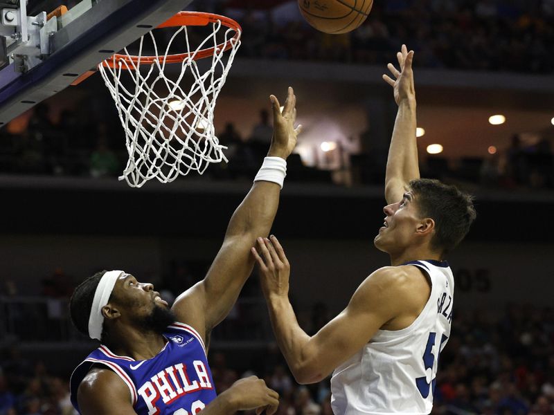 DES MOINES, IOWA - OCTOBER 11: Luka Garza #55 of the Minnesota Timberwolves takes a shot as Guerschon Yabusele #28 of the Philadelphia 76ers blocks in the first half of play during a preseason game at Wells Fargo Arena on October 11, 2024, in Des Moines, Iowa. NOTE TO USER: User expressly acknowledges and agrees that, by downloading and or using this photograph, User is consenting to the terms and conditions of the Getty Images License Agreement (Photo by David Purdy/Getty Images)