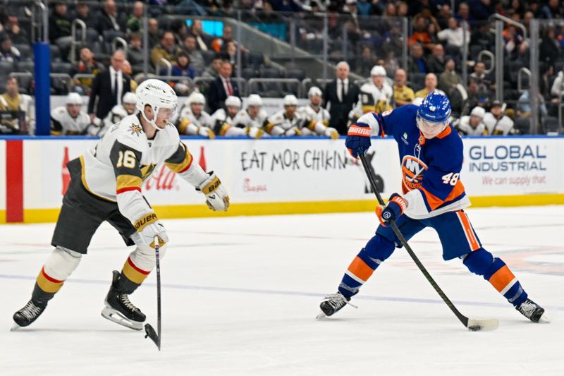 Dec 9, 2025; Elmont, New York, USA; New York Islanders defenseman Matthew Schaefer (48) shoots the puck defended by Vegas Golden Knights right wing Pavel Dorofeyev (16) during the second period at UBS Arena. Mandatory Credit: Dennis Schneidler-Imagn Images