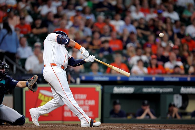 Sep 25, 2024; Houston, Texas, USA; Houston Astros first baseman Jon Singleton (28) hits a double to left field against the Seattle Mariners during the third inning at Minute Maid Park. Mandatory Credit: Erik Williams-Imagn Images