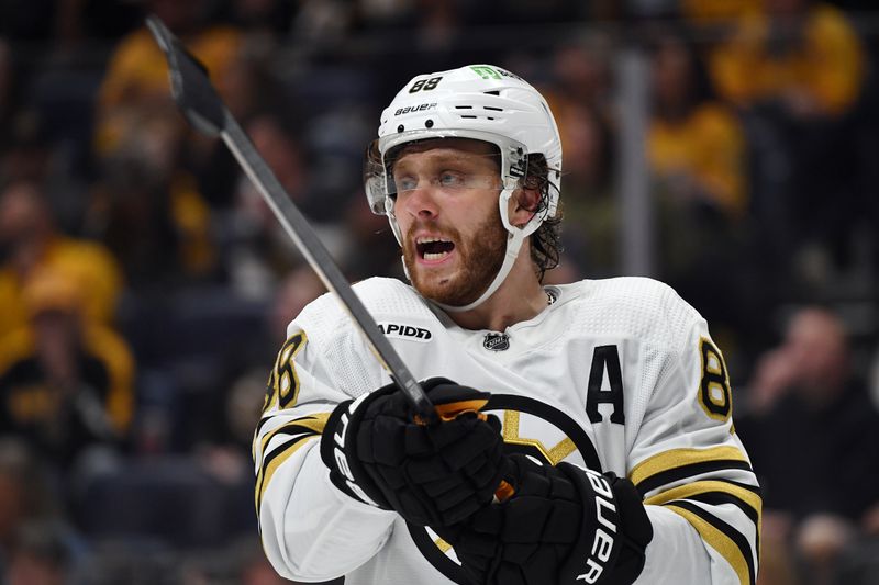 Apr 2, 2024; Nashville, Tennessee, USA; Boston Bruins right wing David Pastrnak (88) moves players before a face off during the second period against the Nashville Predators at Bridgestone Arena. Mandatory Credit: Christopher Hanewinckel-USA TODAY Sports