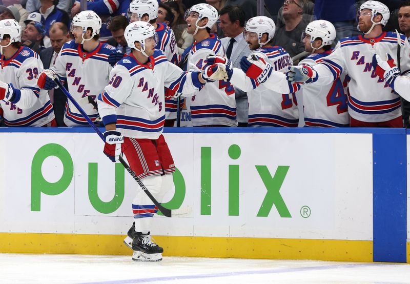 Nov 12, 2025; Tampa, Florida, USA; New York Rangers left wing Will Cuylle (50) is congratulated after he scored a goal against the Tampa Bay Lightning during the first period at Benchmark International Arena. Mandatory Credit: Kim Klement Neitzel-Imagn Images