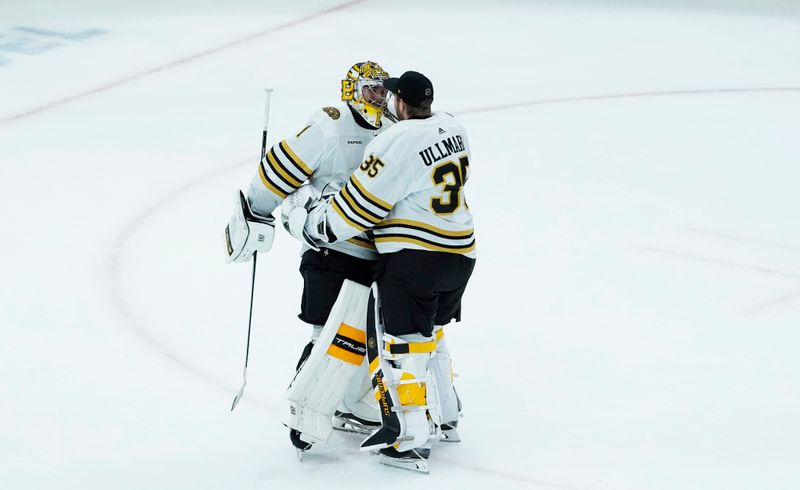 Oct 24, 2023; Chicago, Illinois, USA; Boston Bruins goaltender Jeremy Swayman (1) and goaltender Linus Ullmark (35) celebrate their win against the Chicago Blackhawks at United Center. Mandatory Credit: David Banks-USA TODAY Sports