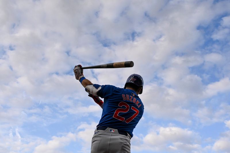 Jul 11, 2024; Baltimore, Maryland, USA;  Chicago Cubs outfielder Seiya Suzuki (27) warms up before a third inning at-bat against the Baltimore Orioles at Oriole Park at Camden Yards. Mandatory Credit: Tommy Gilligan-USA TODAY Sports