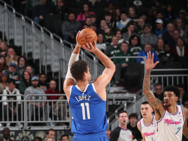 MILWAUKEE, WI - FEBRUARY 23:  Brook Lopez #11 of the Milwaukee Bucks shoots a three point basket during the game against the Miami Heat on February 23, 2025 at Fiserv Forum Center in Milwaukee, Wisconsin. NOTE TO USER: User expressly acknowledges and agrees that, by downloading and or using this Photograph, user is consenting to the terms and conditions of the Getty Images License Agreement. Mandatory Copyright Notice: Copyright 2025 NBAE (Photo by Gary Dineen/NBAE via Getty Images).