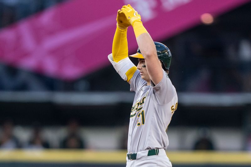 May 11, 2024; Seattle, Washington, USA; Oakland Athletics first baseman Tyler Soderstrom (21) celebrates at second base after hitting a double during the sixth inning against the Seattle Mariners at T-Mobile Park. Mandatory Credit: Stephen Brashear-USA TODAY Sports