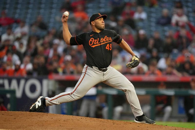 Apr 22, 2024; Anaheim, California, USA; Baltimore Orioles pitcher Albert Suarez (49) throws in the second inning against the Los Angeles Angels at Angel Stadium. Mandatory Credit: Kirby Lee-USA TODAY Sports