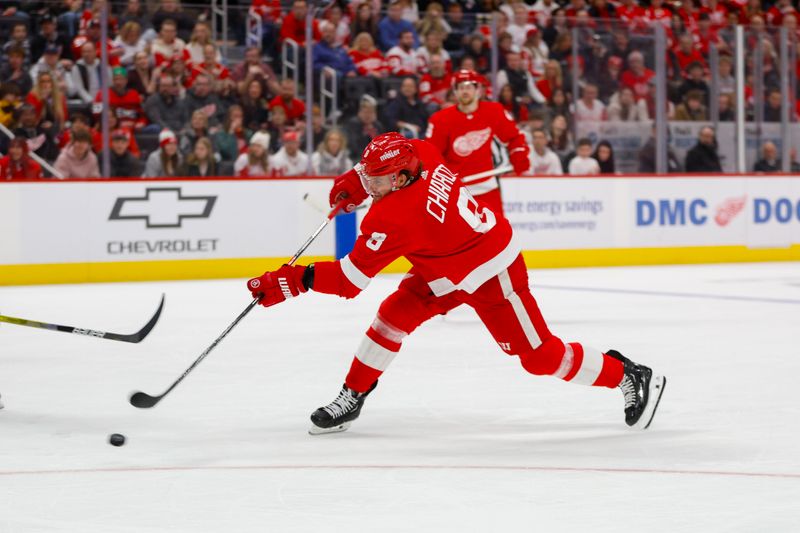 Dec 31, 2023; Detroit, Michigan, USA; Detroit Red Wings defenseman Ben Chiarot (8) shoots the puck for a goal during the second period of the game between the Boston Bruins and the Detroit Red Wings at Little Caesars Arena. Mandatory Credit: Brian Bradshaw Sevald-USA TODAY Sports