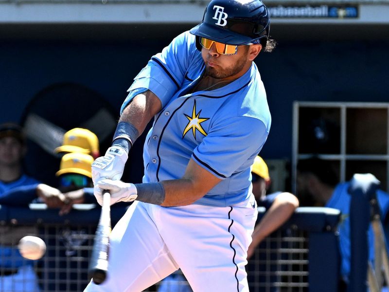 Feb 24, 2024; Port Charlotte, Florida, USA; Tampa Bay Rays first baseman Jonathan Aranda (62) hits a double in the first inning of a spring training game against the Atlanta Braves at Charlotte Sports Park. Mandatory Credit: Jonathan Dyer-USA TODAY Sports