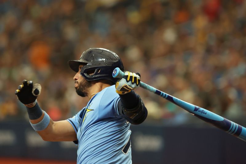 Aug 18, 2024; St. Petersburg, Florida, USA;  Tampa Bay Rays second baseman Jose Caballero (7) hits a 2-RBI double against the Arizona Diamondbacks during the fifth inning at Tropicana Field. Mandatory Credit: Kim Klement Neitzel-USA TODAY Sports