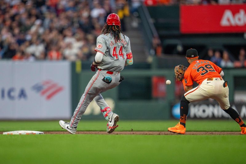 May 10, 2024; San Francisco, California, USA; Cincinnati Reds shortstop Elly De La Cruz (44) after hitting a single advances to second base on a fielding error against San Francisco Giants second baseman Thairo Estrada (39) during the third inning at Oracle Park. Mandatory Credit: Neville E. Guard-USA TODAY Sports