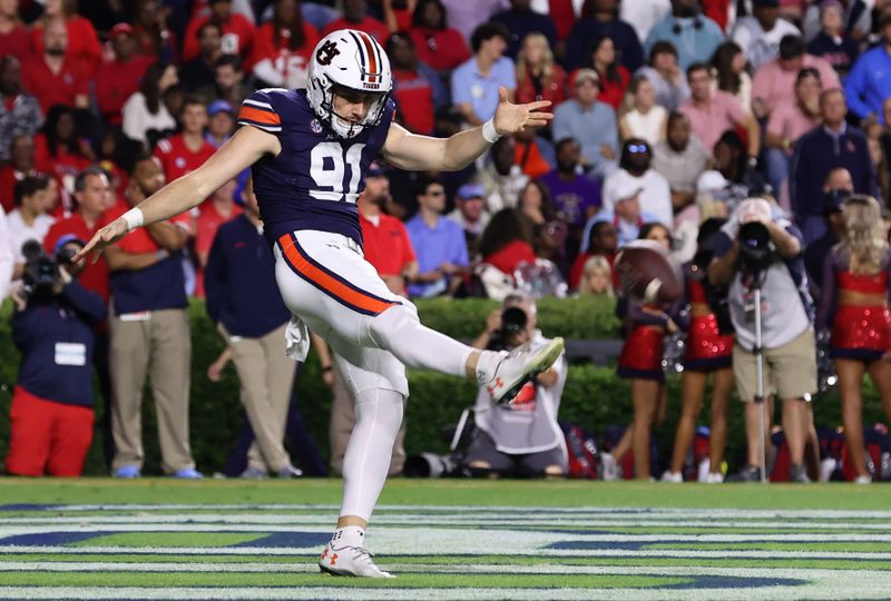 Oct 21, 2023; Auburn, Alabama, USA;  Auburn Tigers punter Oscar Chapman (91) kicks from the end zone during the third quarter against the Mississippi Rebels at Jordan-Hare Stadium. Mandatory Credit: John Reed-USA TODAY Sports