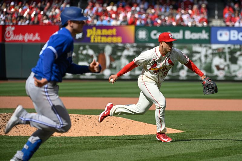 Apr 1, 2023; St. Louis, Missouri, USA; St. Louis Cardinals relief pitcher Ryan Helsley (56) throws out Toronto Blue Jays catcher Danny Jansen (9) in the eighth inning at Busch Stadium. Mandatory Credit: Joe Puetz-USA TODAY Sports