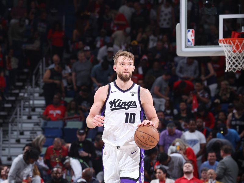 NEW ORLEANS, LA - APRIL 19:  Domantas Sabonis #10 of the Sacramento Kings handles the ball during the game  against the New Orleans Pelicans during the 2024 Play-In Tournament on April 19, 2024 at the Smoothie King Center in New Orleans, Louisiana. NOTE TO USER: User expressly acknowledges and agrees that, by downloading and or using this Photograph, user is consenting to the terms and conditions of the Getty Images License Agreement. Mandatory Copyright Notice: Copyright 2024 NBAE (Photo by Jeff Haynes./NBAE via Getty Images)