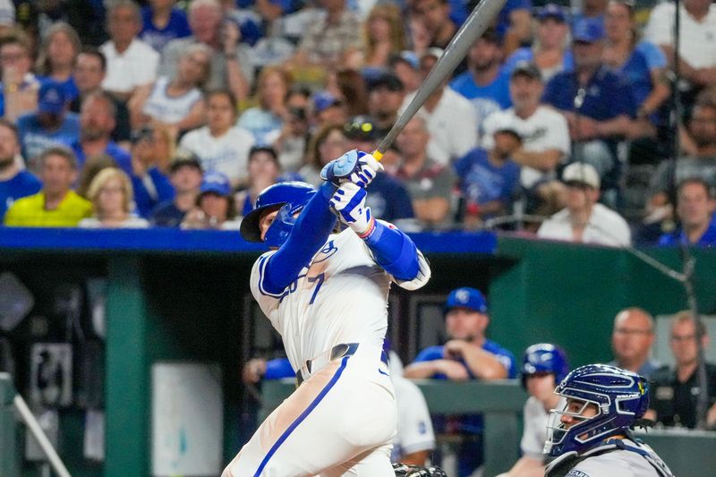 Jun 10, 2024; Kansas City, Missouri, USA; Kansas City Royals shortstop Bobby Witt Jr. (7) hits an RBI double against the New York Yankees in the eighth inning at Kauffman Stadium. Mandatory Credit: Denny Medley-USA TODAY Sports