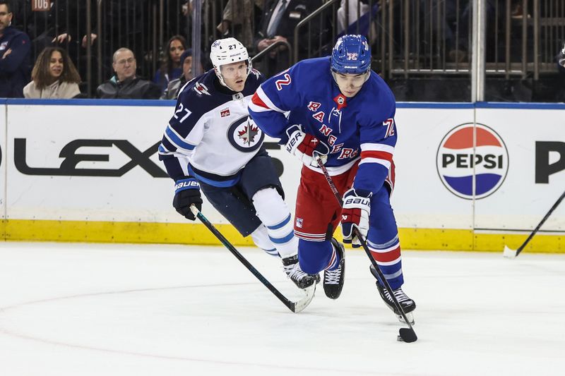 Nov 12, 2024; New York, New York, USA;  New York Rangers center Filip Chytil (72) skates past Winnipeg Jets left wing Nikolaj Ehlers (27) in the first period at Madison Square Garden. Mandatory Credit: Wendell Cruz-Imagn Images