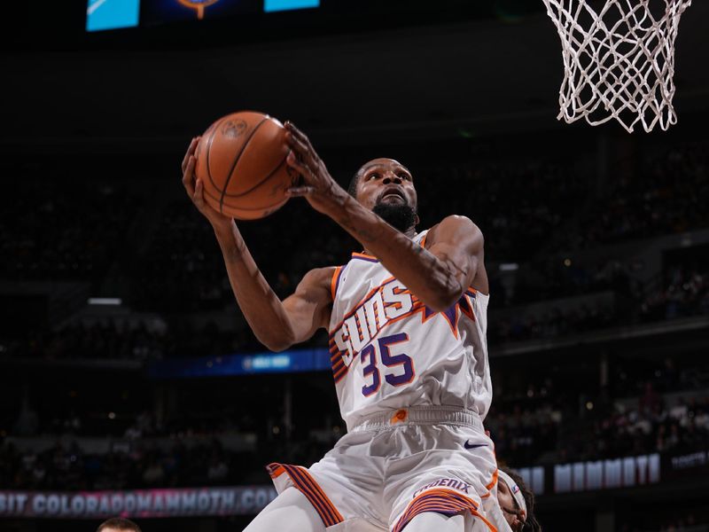 DENVER, CO - MARCH 5: Kevin Durant #35 of the Phoenix Suns drives to the basket during the game against the Denver Nuggets on March 5, 2024 at the Ball Arena in Denver, Colorado. NOTE TO USER: User expressly acknowledges and agrees that, by downloading and/or using this Photograph, user is consenting to the terms and conditions of the Getty Images License Agreement. Mandatory Copyright Notice: Copyright 2024 NBAE (Photo by Bart Young/NBAE via Getty Images)