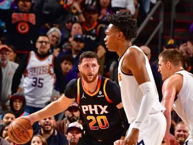 PHOENIX, AZ - DECEMBER 1: Jusuf Nurkic #20 of the Phoenix Suns dribbles the ball during the game against the Denver Nuggets on December 1, 2023 at Footprint Center in Phoenix, Arizona. NOTE TO USER: User expressly acknowledges and agrees that, by downloading and or using this photograph, user is consenting to the terms and conditions of the Getty Images License Agreement. Mandatory Copyright Notice: Copyright 2023 NBAE (Photo by Barry Gossage/NBAE via Getty Images)