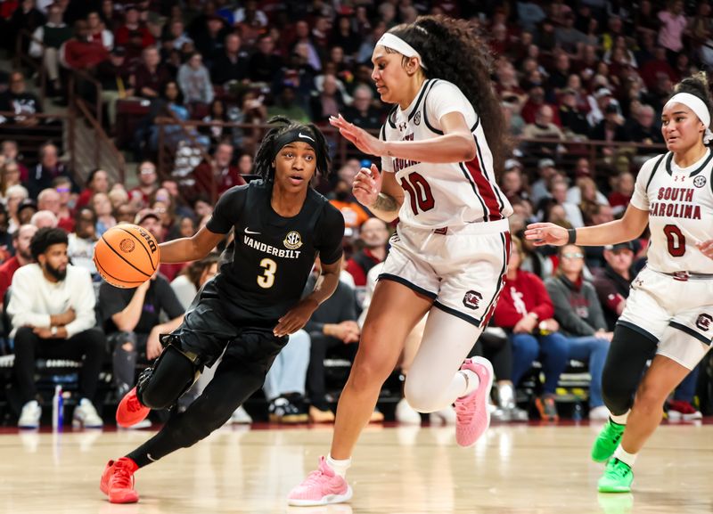 Jan 28, 2024; Columbia, South Carolina, USA; Vanderbilt Commodores guard Jordyn Cambridge (3) drives around South Carolina Gamecocks center Kamilla Cardoso (10) in the second half at Colonial Life Arena. Mandatory Credit: Jeff Blake-USA TODAY Sports