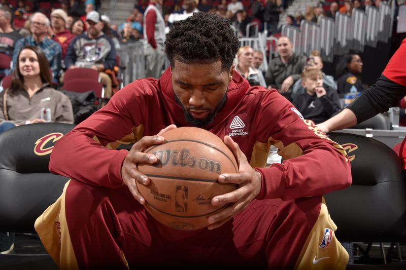 CLEVELAND, OH - APRIL 12: Donovan Mitchell #45 of the Cleveland Cavaliers looks on before the game against the Indiana Pacers on April 12, 2024 at Rocket Mortgage FieldHouse in Cleveland, Ohio. NOTE TO USER: User expressly acknowledges and agrees that, by downloading and/or using this Photograph, user is consenting to the terms and conditions of the Getty Images License Agreement. Mandatory Copyright Notice: Copyright 2024 NBAE (Photo by David Liam Kyle/NBAE via Getty Images)