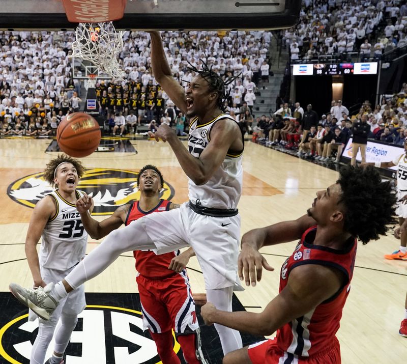 Mar 4, 2023; Columbia, Missouri, USA; Missouri Tigers forward Aidan Shaw (23) dunks the ball as Mississippi Rebels forward Jaemyn Brakefield (4) defends during the second half at Mizzou Arena. Mandatory Credit: Denny Medley-USA TODAY Sports