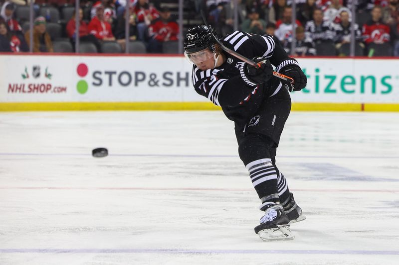 Dec 23, 2023; Newark, New Jersey, USA; New Jersey Devils right wing Tyler Toffoli (73) shoots the puck against the Detroit Red Wings during the second period at Prudential Center. Mandatory Credit: Ed Mulholland-USA TODAY Sports