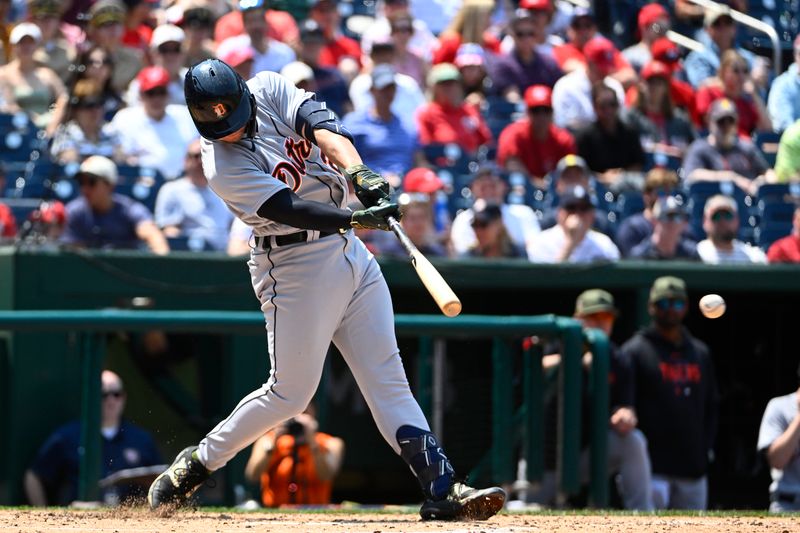 May 21, 2023; Washington, District of Columbia, USA; Detroit Tigers starting pitcher Michael Lorenzen (21) hits a RBI single against the Washington Nationals during the third inning at Nationals Park. Mandatory Credit: Brad Mills-USA TODAY Sports
