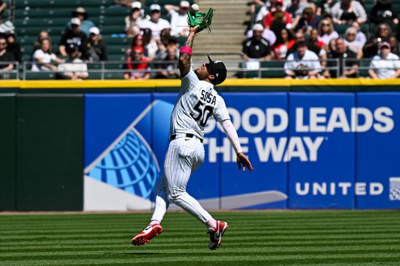 May 11, 2025; Chicago, Illinois, USA;   Chicago White Sox second base Lenyn Sosa (50) catches a fly ball hit by Miami Marlins outfielder Javier Sanoja (46)  during the sixth inning at Rate Field. Mandatory Credit: Matt Marton-Imagn Images