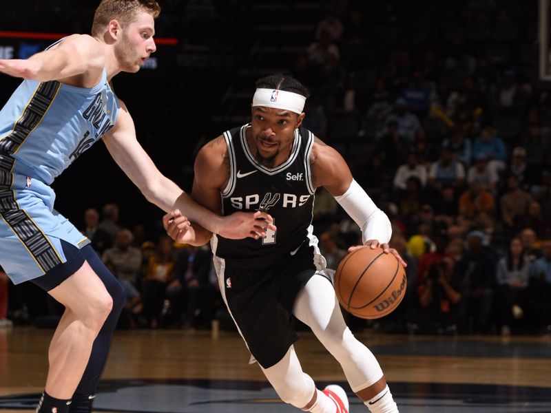 MEMPHIS, TN - APRIL 9: Devonte Graham #4 of the San Antonio Spurs drives to the basket during the game against the Memphis Grizzlies on April 9, 2024 at FedExForum in Memphis, Tennessee. NOTE TO USER: User expressly acknowledges and agrees that, by downloading and or using this photograph, User is consenting to the terms and conditions of the Getty Images License Agreement. Mandatory Copyright Notice: Copyright 2024 NBAE (Photo by Grant Burke/NBAE via Getty Images)