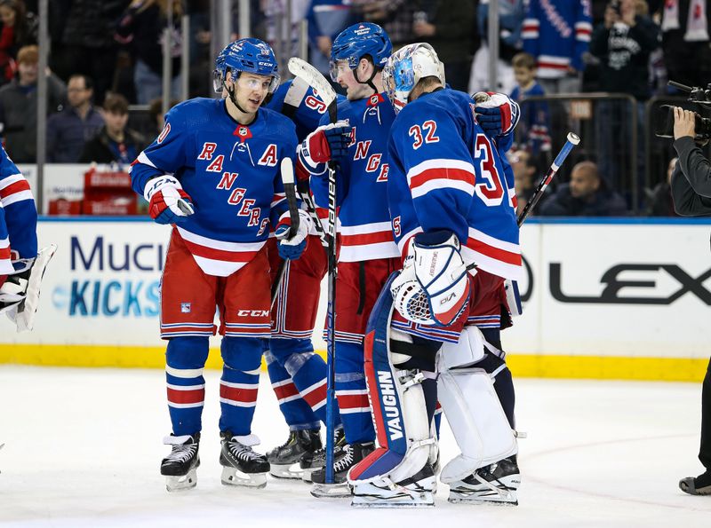 Nov 25, 2023; New York, New York, USA; New York Rangers left wing Artemi Panarin (10) celebrates a 7-4 win against the Boston Bruins with forward Alexis Lafreniere (13) and goalie Jonathan Quick (32) d at Madison Square Garden. Mandatory Credit: Danny Wild-USA TODAY Sports