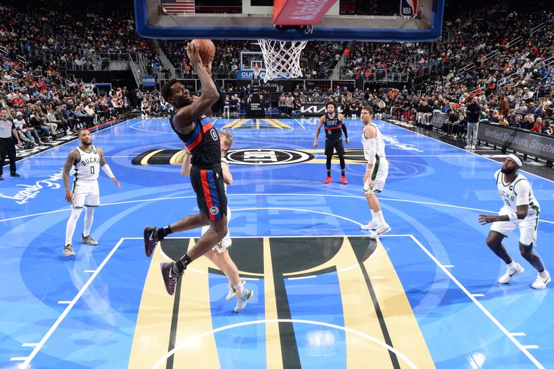 DETROIT, MI - DECEMBER 3: Jalen Duren #0 of the Detroit Pistons drives to the basket during the game against the Milwaukee Bucks during the Emirates NBA Cup game on December 3, 2024 at Little Caesars Arena in Detroit, Michigan. NOTE TO USER: User expressly acknowledges and agrees that, by downloading and/or using this photograph, User is consenting to the terms and conditions of the Getty Images License Agreement. Mandatory Copyright Notice: Copyright 2024 NBAE (Photo by Chris Schwegler/NBAE via Getty Images)