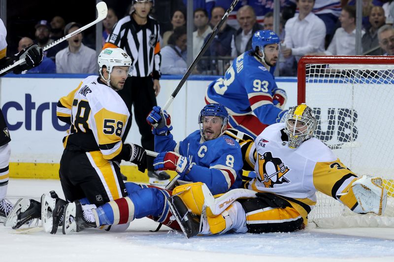 Oct 7, 2025; New York, New York, USA; New York Rangers center J.T. Miller (8) reacts after being pushed into Pittsburgh Penguins goaltender Arturs Silovs (37) by Penguins defenseman Kris Letang (58) during the third period at Madison Square Garden. Mandatory Credit: Brad Penner-Imagn Images