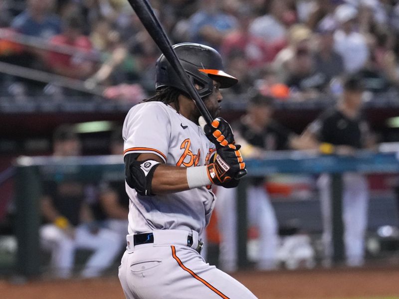 Sep 3, 2023; Phoenix, Arizona, USA; Baltimore Orioles center fielder Cedric Mullins (31) hits an RBI single against the Arizona Diamondbacks during the sixth inning at Chase Field. Mandatory Credit: Joe Camporeale-USA TODAY Sports