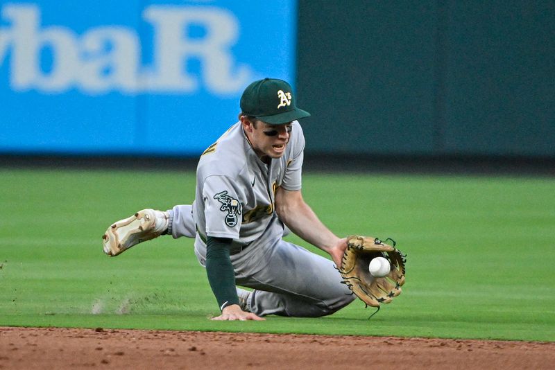 Aug 16, 2023; St. Louis, Missouri, USA;  Oakland Athletics shortstop Nick Allen (2) dives and fields a ground ball against the St. Louis Cardinals during the sixth inning at Busch Stadium. Mandatory Credit: Jeff Curry-USA TODAY Sports