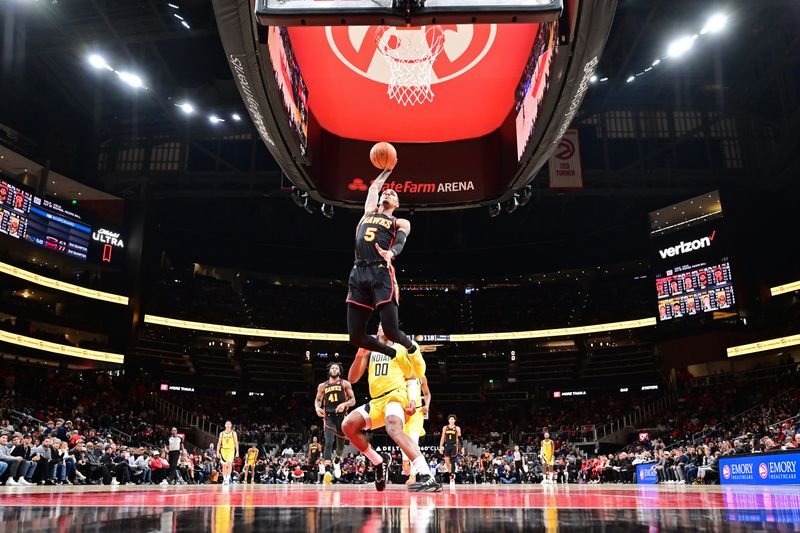 ATLANTA, GA - JANUARY 12: Dejounte Murray #5 of the Atlanta Hawks dunks the ball during the game against the Indiana Pacers on January 12, 2024 at State Farm Arena in Atlanta, Georgia.  NOTE TO USER: User expressly acknowledges and agrees that, by downloading and/or using this Photograph, user is consenting to the terms and conditions of the Getty Images License Agreement. Mandatory Copyright Notice: Copyright 2024 NBAE (Photo by Adam Hagy/NBAE via Getty Images)