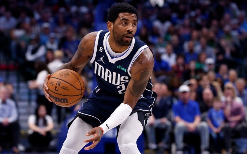 DALLAS, TX - MARCH 5: Kyrie Irving #2 of the Dallas Mavericks handles the ball against the Phoenix Suns in the first half at American Airlines Center on March 5, 2023 in Dallas, Texas. NOTE TO USER: User expressly acknowledges and agrees that, by downloading and or using this photograph, User is consenting to the terms and conditions of the Getty Images License Agreement. (Photo by Ron Jenkins/Getty Images)