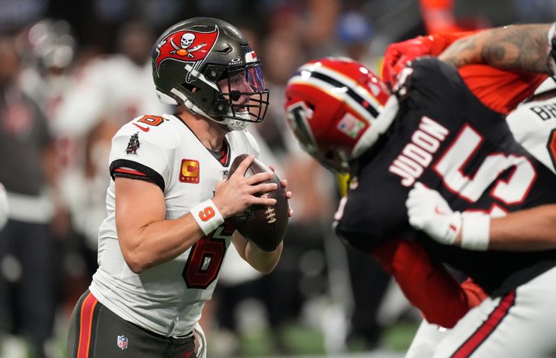 Tampa Bay Buccaneers quarterback Baker Mayfield (6) looks to pass against the Atlanta Falcons during the first half of an NFL football game Thursday, Oct. 3, 2024, in Atlanta. (AP Photo/John Bazemore)