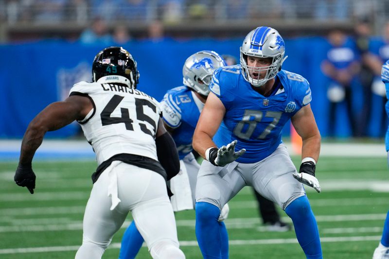 Detroit Lions offensive tackle Matt Nelson (67) blocks Jacksonville Jaguars linebacker K'Lavon Chaisson (45) during an preseason NFL football game in Detroit, Saturday, Aug. 19, 2023. (AP Photo/Paul Sancya)