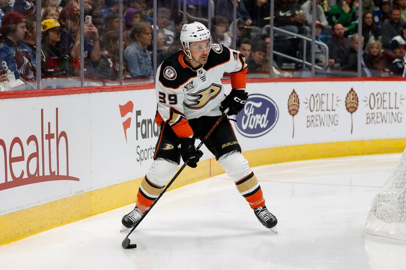 Dec 5, 2023; Denver, Colorado, USA; Anaheim Ducks center Sam Carrick (39) controls the puck in the third period against the Colorado Avalanche at Ball Arena. Mandatory Credit: Isaiah J. Downing-USA TODAY Sports