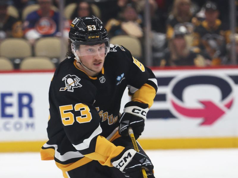 Mar 18, 2025; Pittsburgh, Pennsylvania, USA;  Pittsburgh Penguins center Philip Tomasino (53) skates up ice with the puck against the New York Islanders during the third period at PPG Paints Arena. Mandatory Credit: Charles LeClaire-Imagn Images