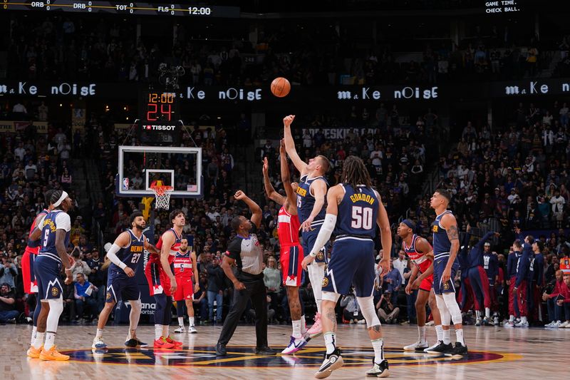 DENVER, CO - FEBRUARY 22: Nikola Jokic #15 of the Denver Nuggets goes up for the opening tip off on February 22, 2024 at the Ball Arena in Denver, Colorado. NOTE TO USER: User expressly acknowledges and agrees that, by downloading and/or using this Photograph, user is consenting to the terms and conditions of the Getty Images License Agreement. Mandatory Copyright Notice: Copyright 2024 NBAE (Photo by Bart Young/NBAE via Getty Images)