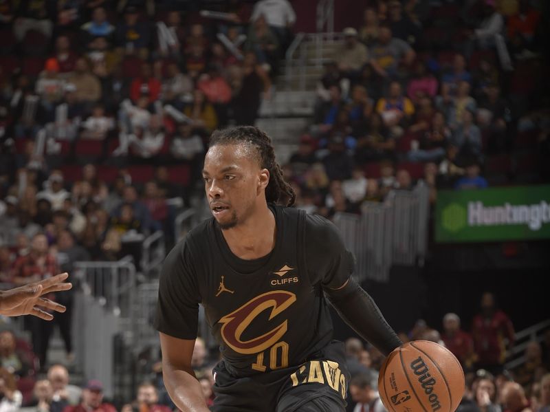 CLEVELAND, OH - NOVEMBER 8: Darius Garland #10 of the Cleveland Cavaliers dribbles the ball during the game against the Golden State Warriors  during a regular season game on November 8, 2024 at Rocket Mortgage FieldHouse in Cleveland, Ohio. NOTE TO USER: User expressly acknowledges and agrees that, by downloading and/or using this Photograph, user is consenting to the terms and conditions of the Getty Images License Agreement. Mandatory Copyright Notice: Copyright 2024 NBAE (Photo by David Liam Kyle/NBAE via Getty Images)